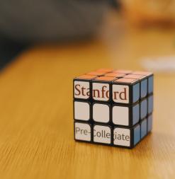 Rubik's cube with Stanford Pre-Collegiate Studies logo