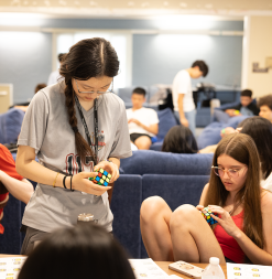 SUMaC students with rubik's cube