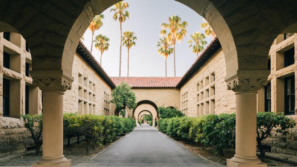 Stanford Campus classrooms, as viewed through a classic campus arch